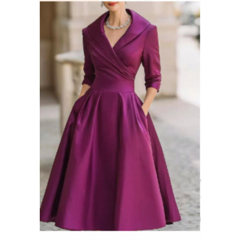 Robe élégante cintrée à taille haute, manches longues, coupe asymétrique raffinée