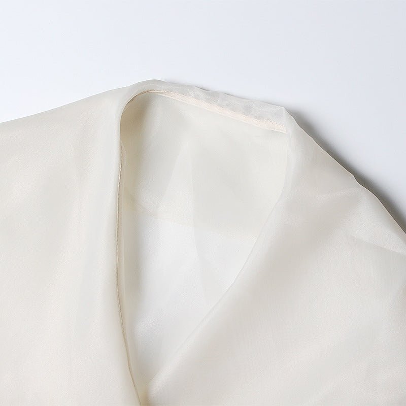Blouse en organza à manches bouffantes style évêque, ceinture nouée, broderie florale raffinée - IVOIRART.COM