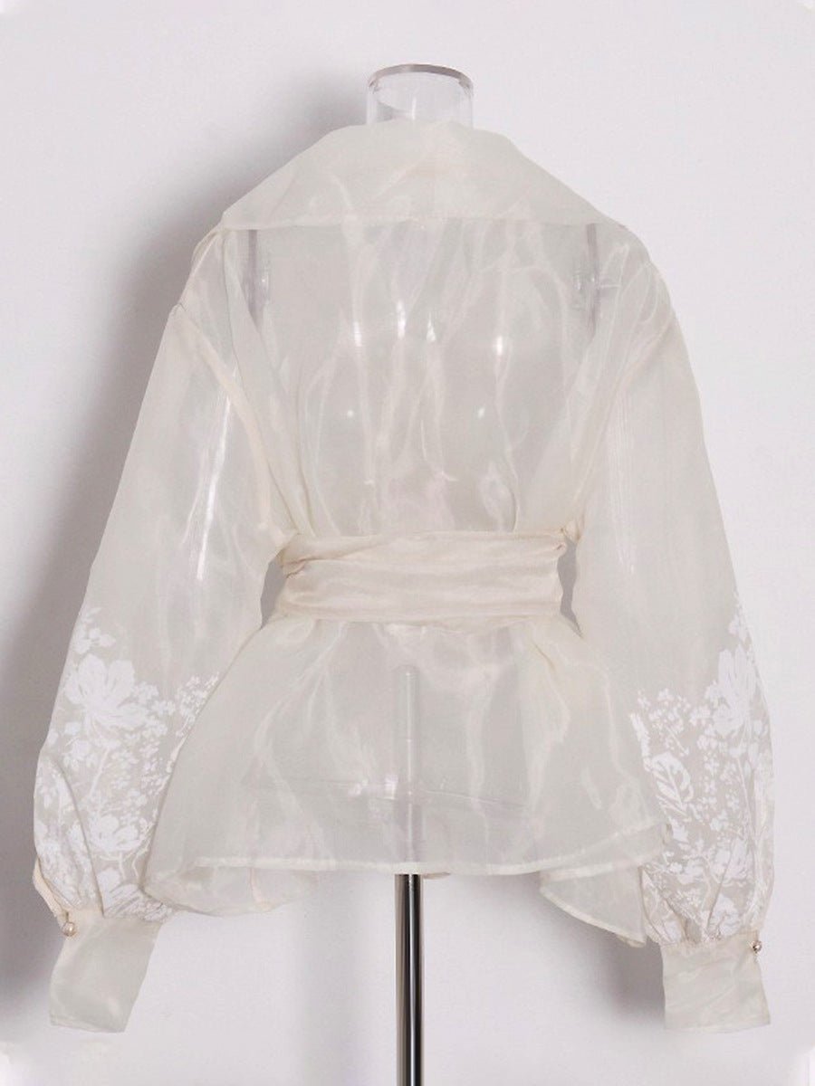 Blouse en organza à manches bouffantes style évêque, ceinture nouée, broderie florale raffinée - IVOIRART.COM