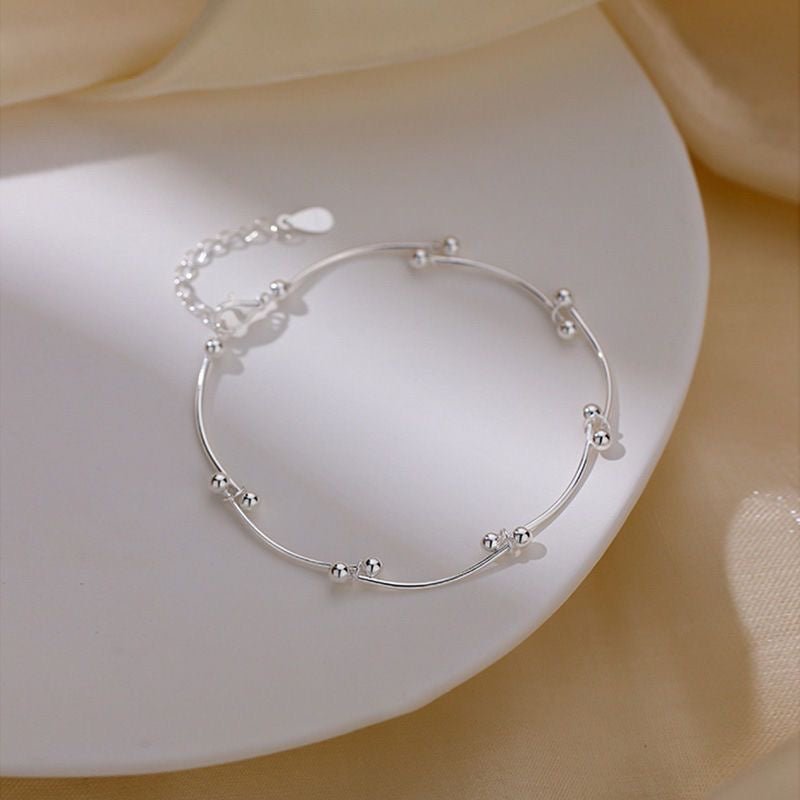 Bracelet de cheville ajustable en argent sterling 999 avec perle tubulaire ondulée, style minimaliste élégant pour l'été et cadeaux romantiques féminins - IVOIRART.COM