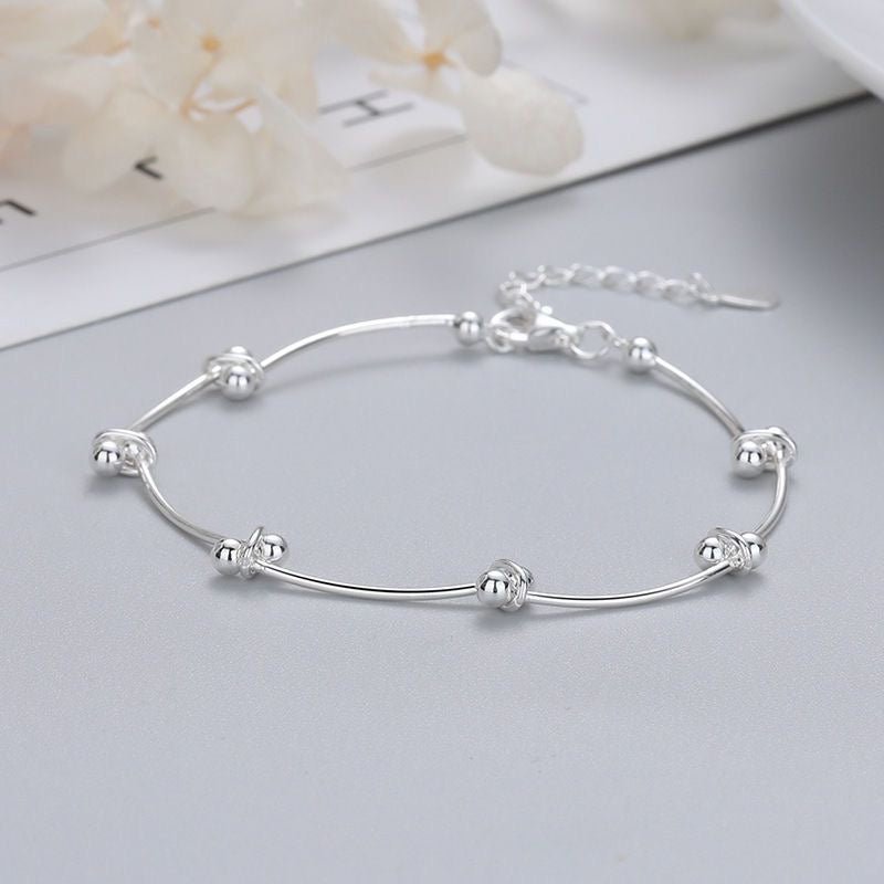 Bracelet de cheville ajustable en argent sterling 999 avec perle tubulaire ondulée, style minimaliste élégant pour l'été et cadeaux romantiques féminins - IVOIRART.COM
