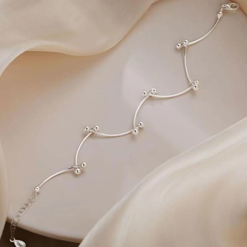 Bracelet de cheville ajustable en argent sterling 999 avec perle tubulaire ondulée, style minimaliste élégant pour l'été et cadeaux romantiques féminins - IVOIRART.COM