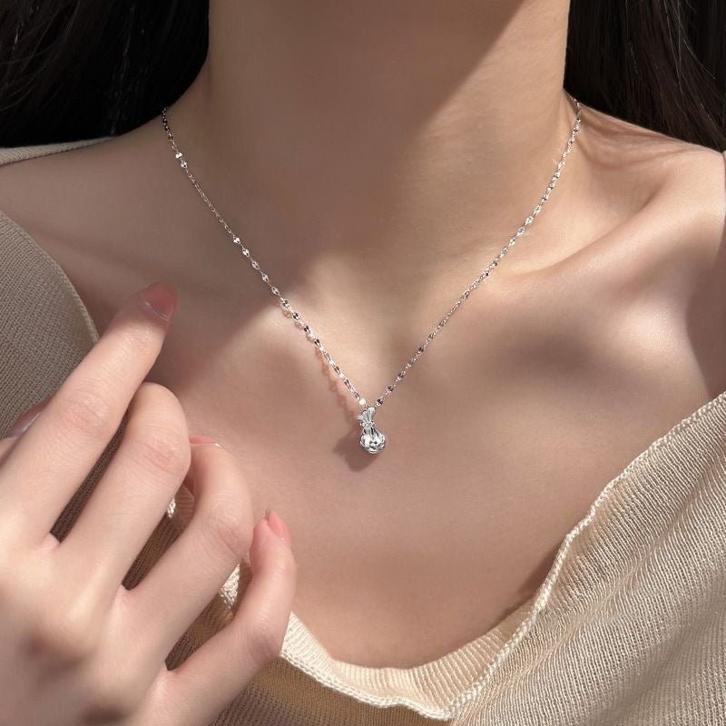 Collier Sac d’Argent Chanceux Creux en Argent 999, Élégant et Délicat, Parfait Cadeau d’Anniversaire - IVOIRART.COM