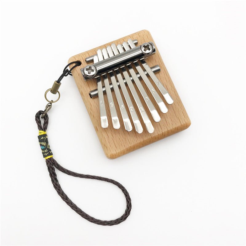 Petit piano à pouces mini 8 notes pour moments musicaux authentiques et portables - IVOIRART.COM