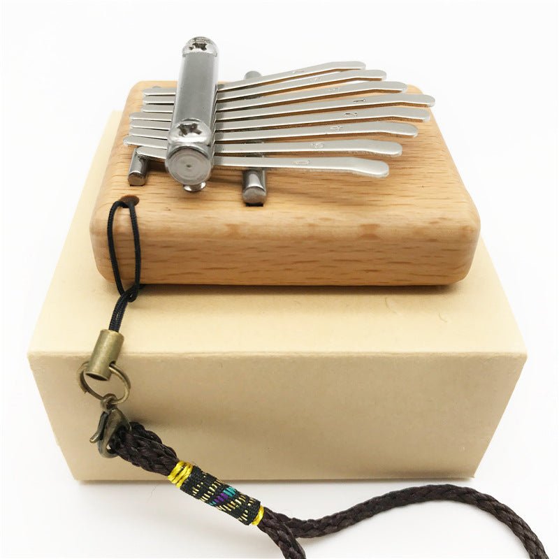 Petit piano à pouces mini 8 notes pour moments musicaux authentiques et portables - IVOIRART.COM