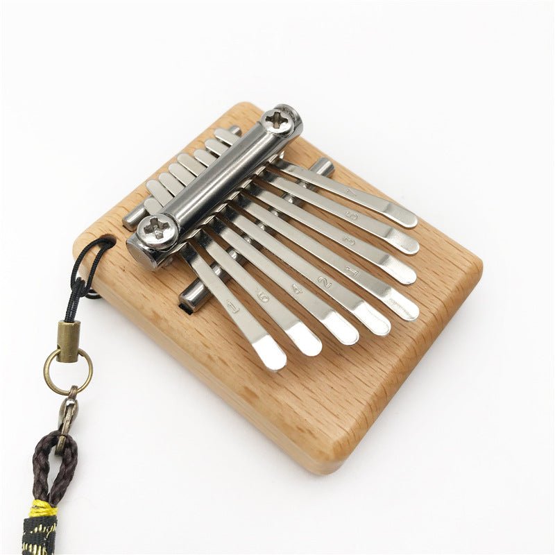 Petit piano à pouces mini 8 notes pour moments musicaux authentiques et portables - IVOIRART.COM